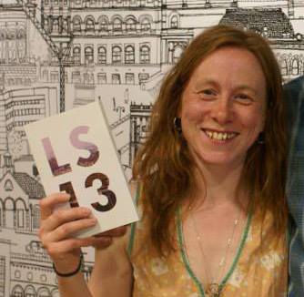 Leeds writer Aissa Gallie with her copy of the LS13 anthology